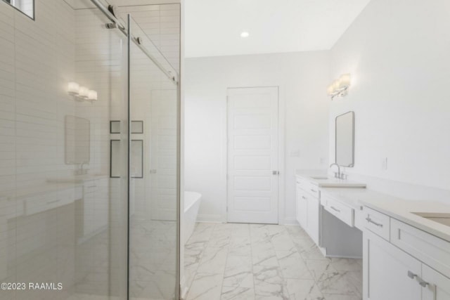 a white bathroom with a glass shower door.