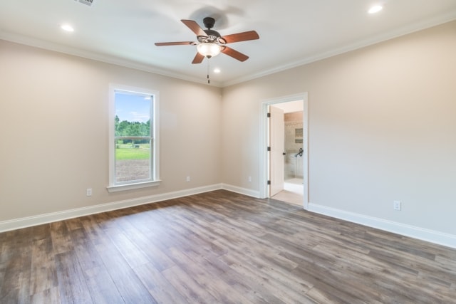 an empty room with hardwood floors and a ceiling fan.