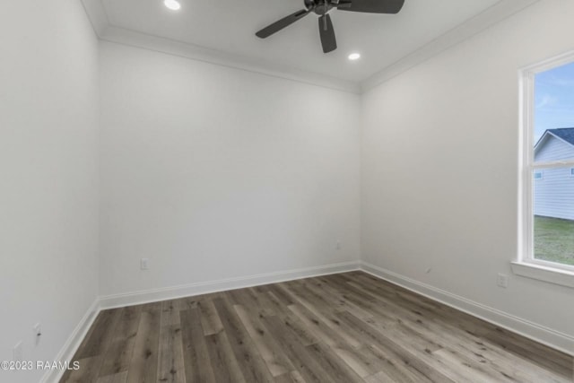 an empty room with white walls and a ceiling fan.
