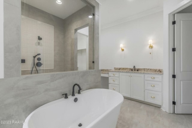 a white bathroom with a large tub and sink.