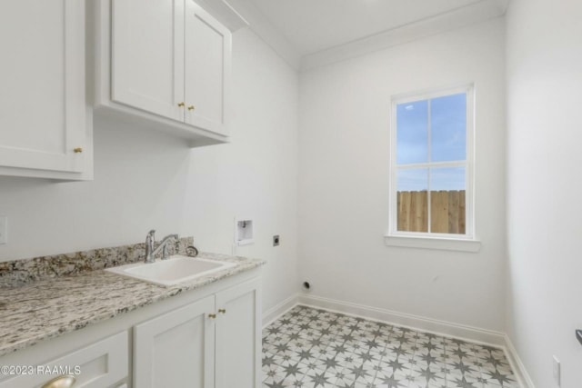 a bathroom with white cabinets and a window.